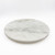 Top-down angled view of empty white marble lazy susan showing subtle veining