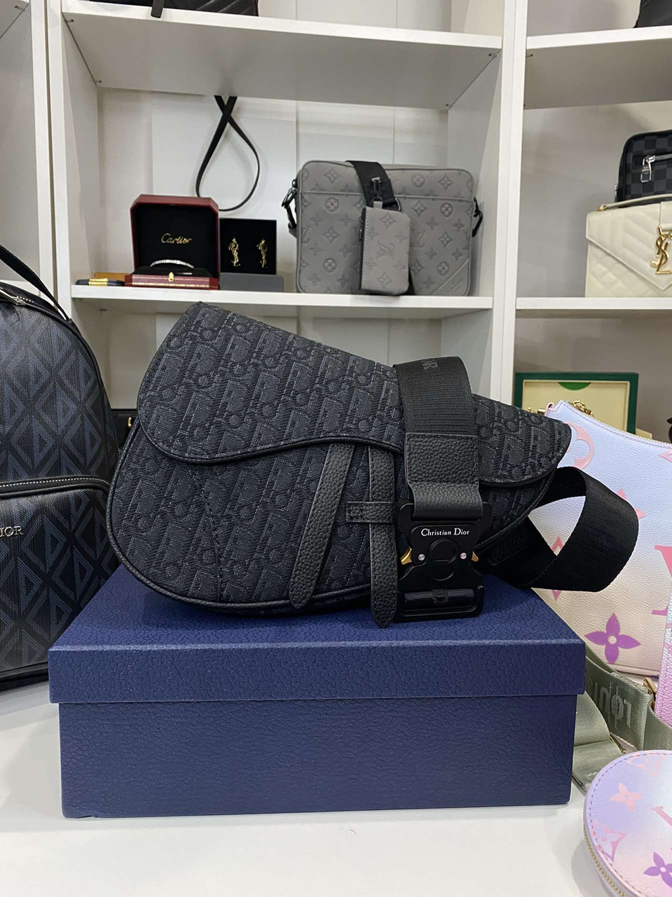 The Dior x Sorayama Saddle Bag Debuted on the PreFall 2019 Mens  Collection Runway  Kim Kardashians 30000 Dior Bag Is Made of Metal and  Looks Like a Musical Instrument  POPSUGAR