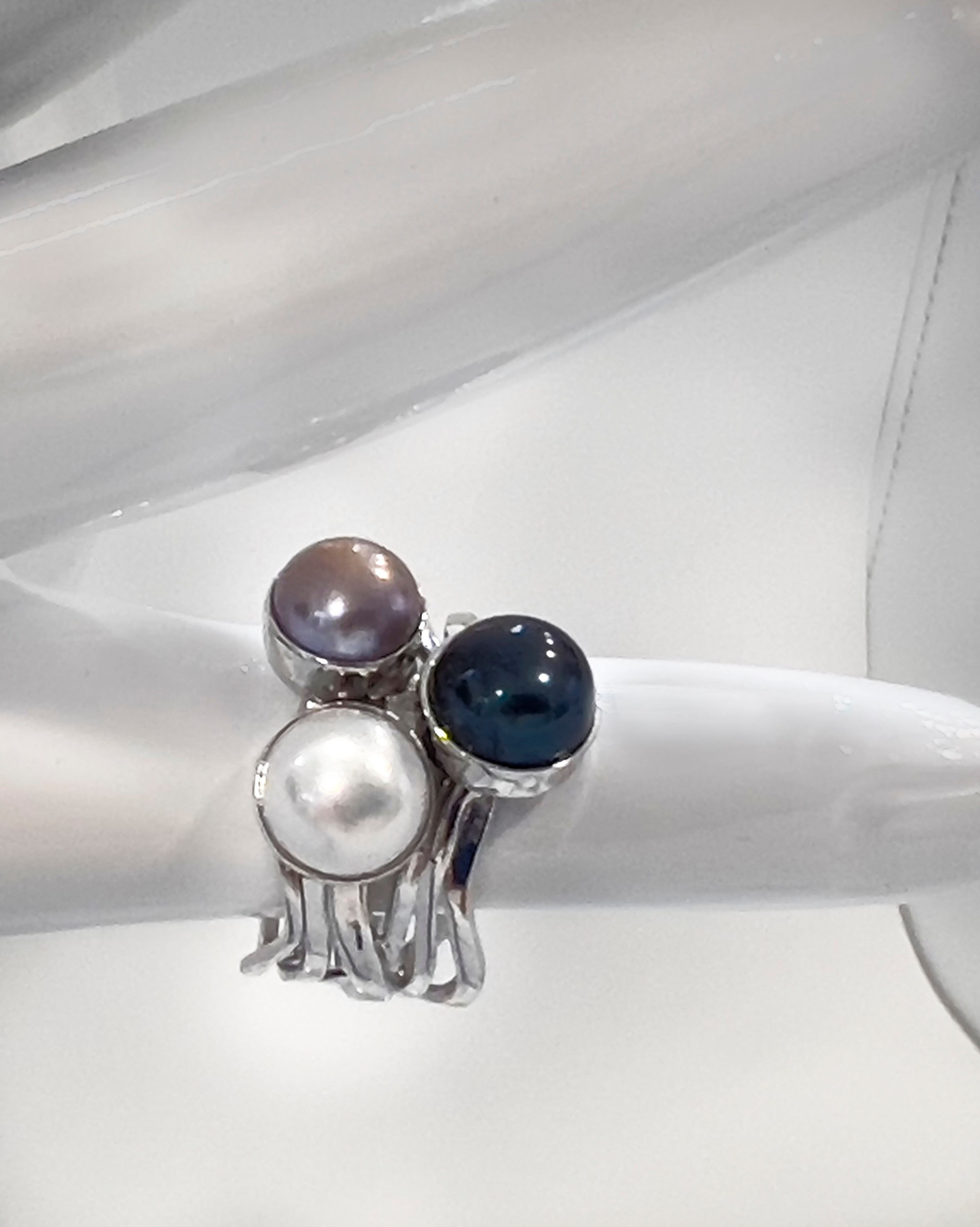 Signature three-colour pearl ring on a layered rhodium-plated sterling silver band
