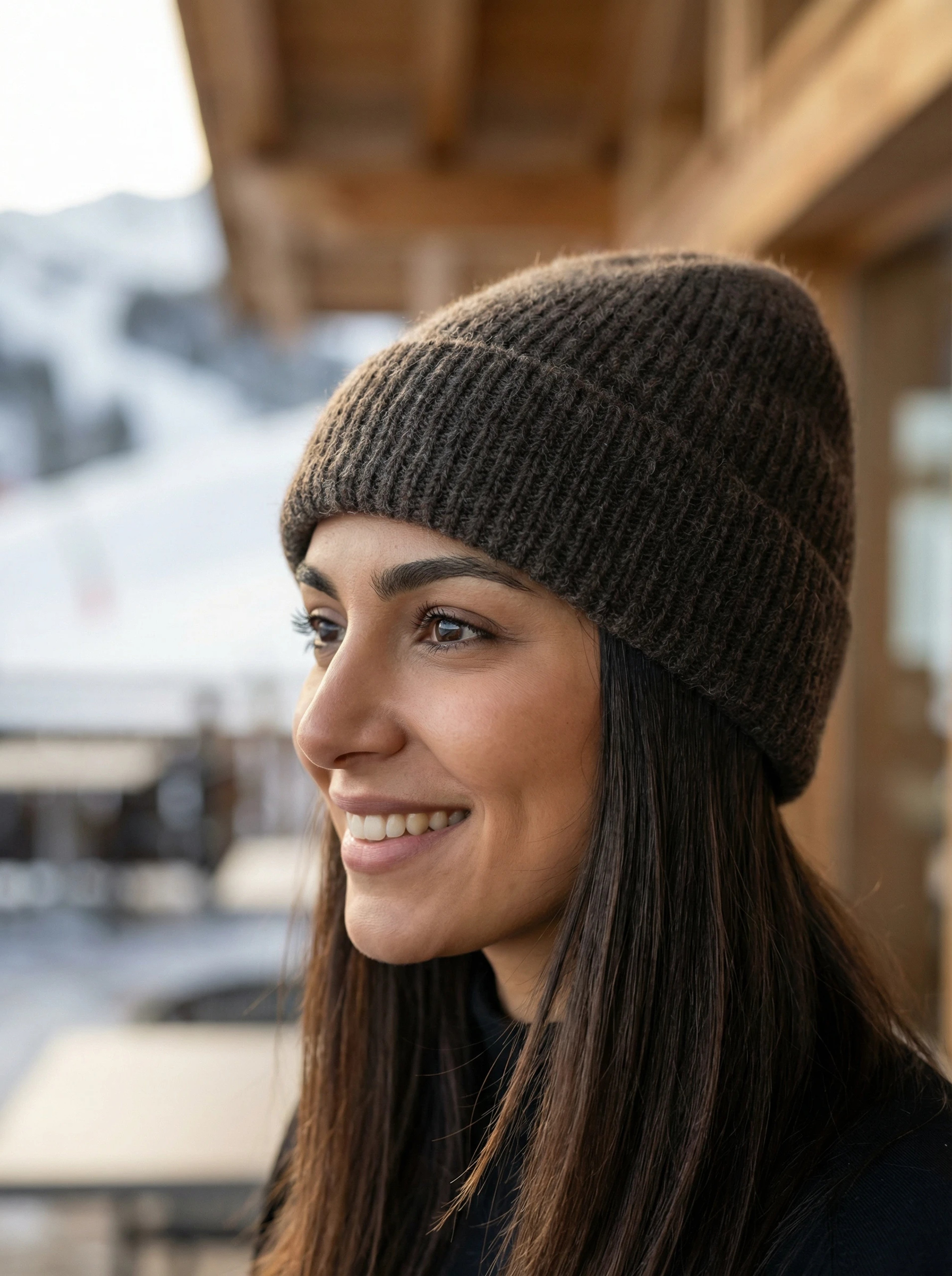 Woman outdoors wearing ribbed yak wool hat in dark brown