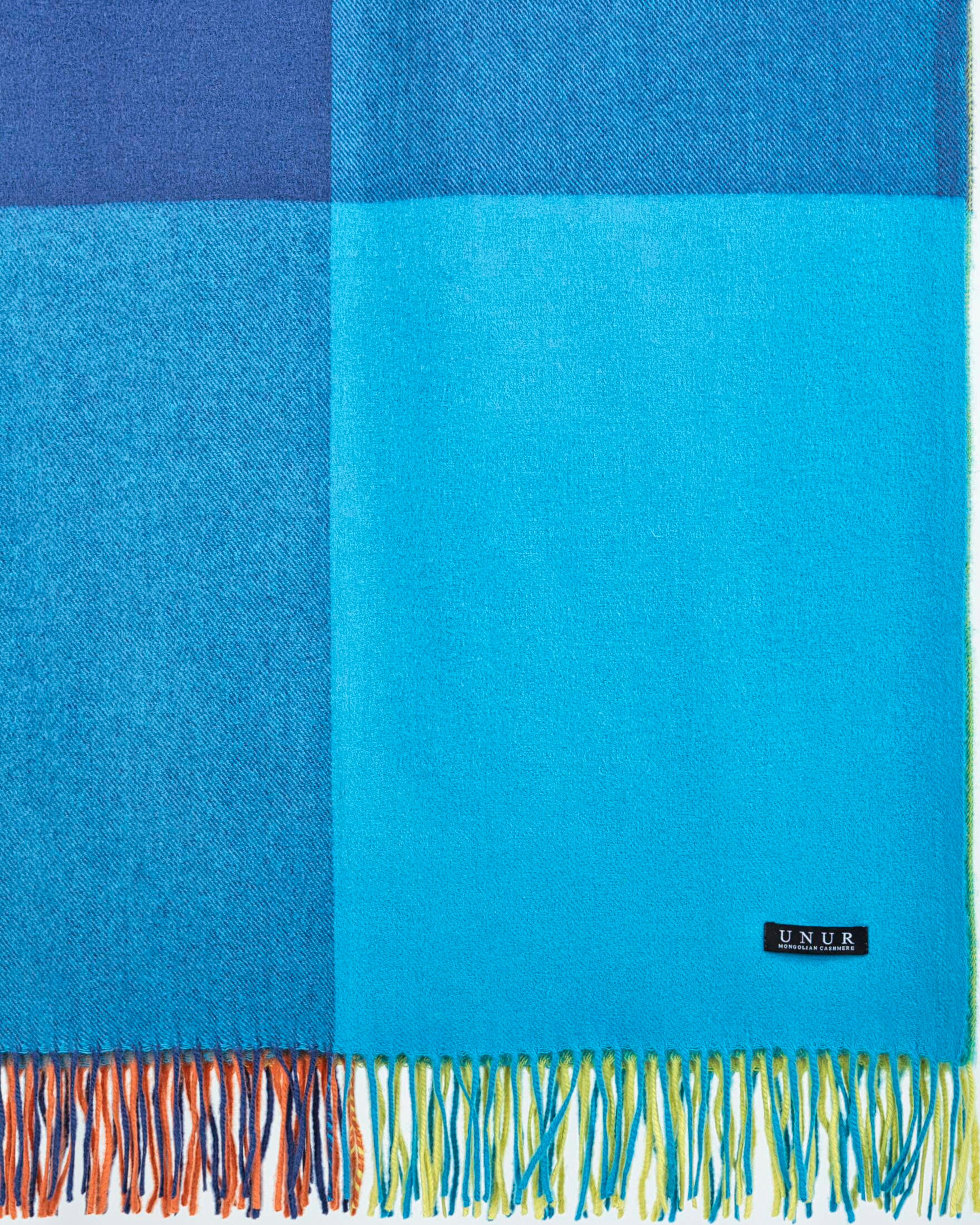 Close-up of soft multi-coloured cashmere checked pattern blanket