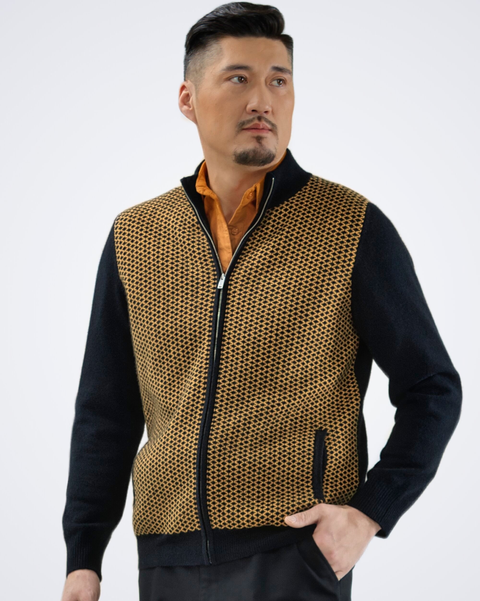 Man wearing a two-tone diamond patterned cardigan in brown, front