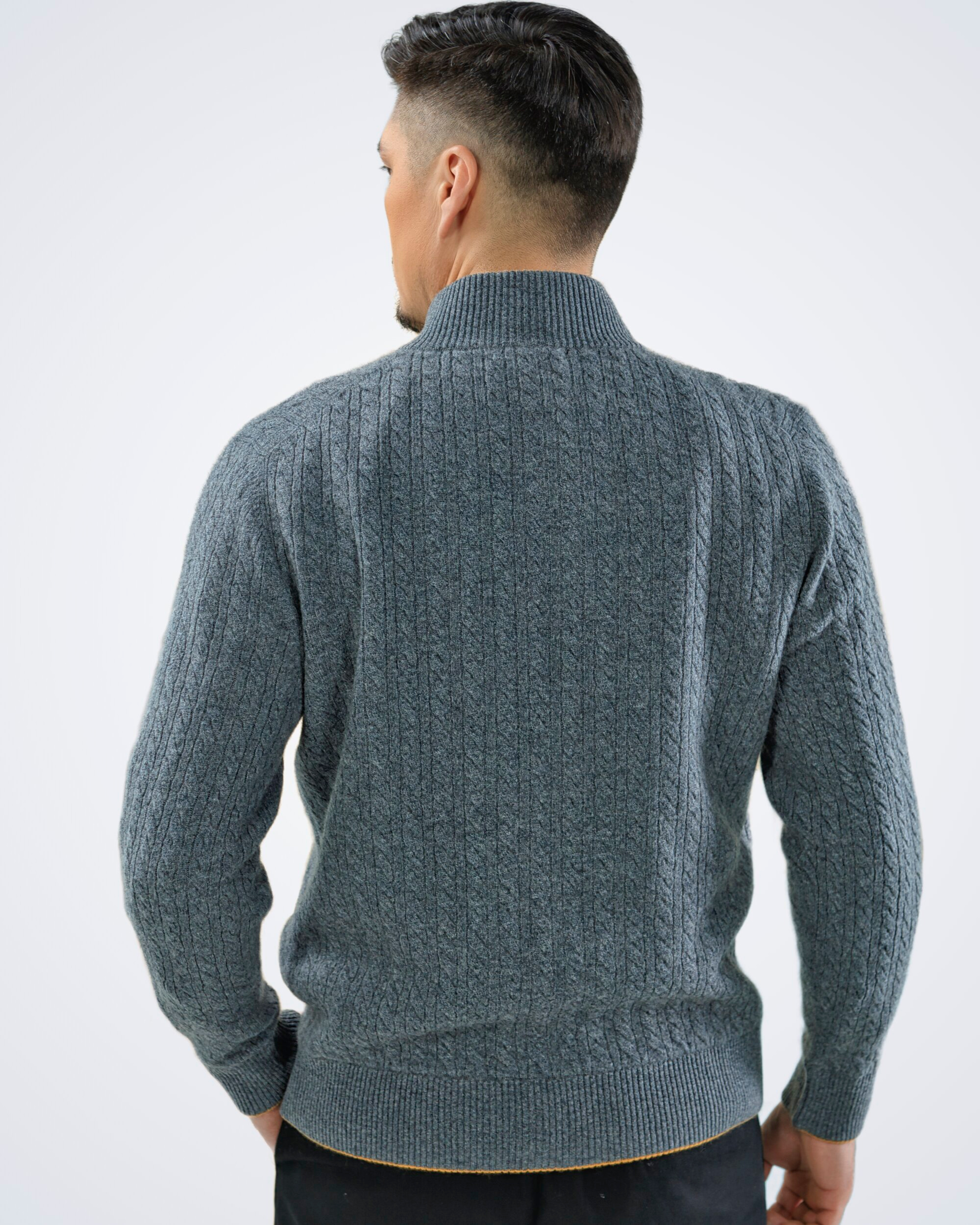 Unur model wearing a men's luxury Mongolian cashmere cable knit cardigan in grey