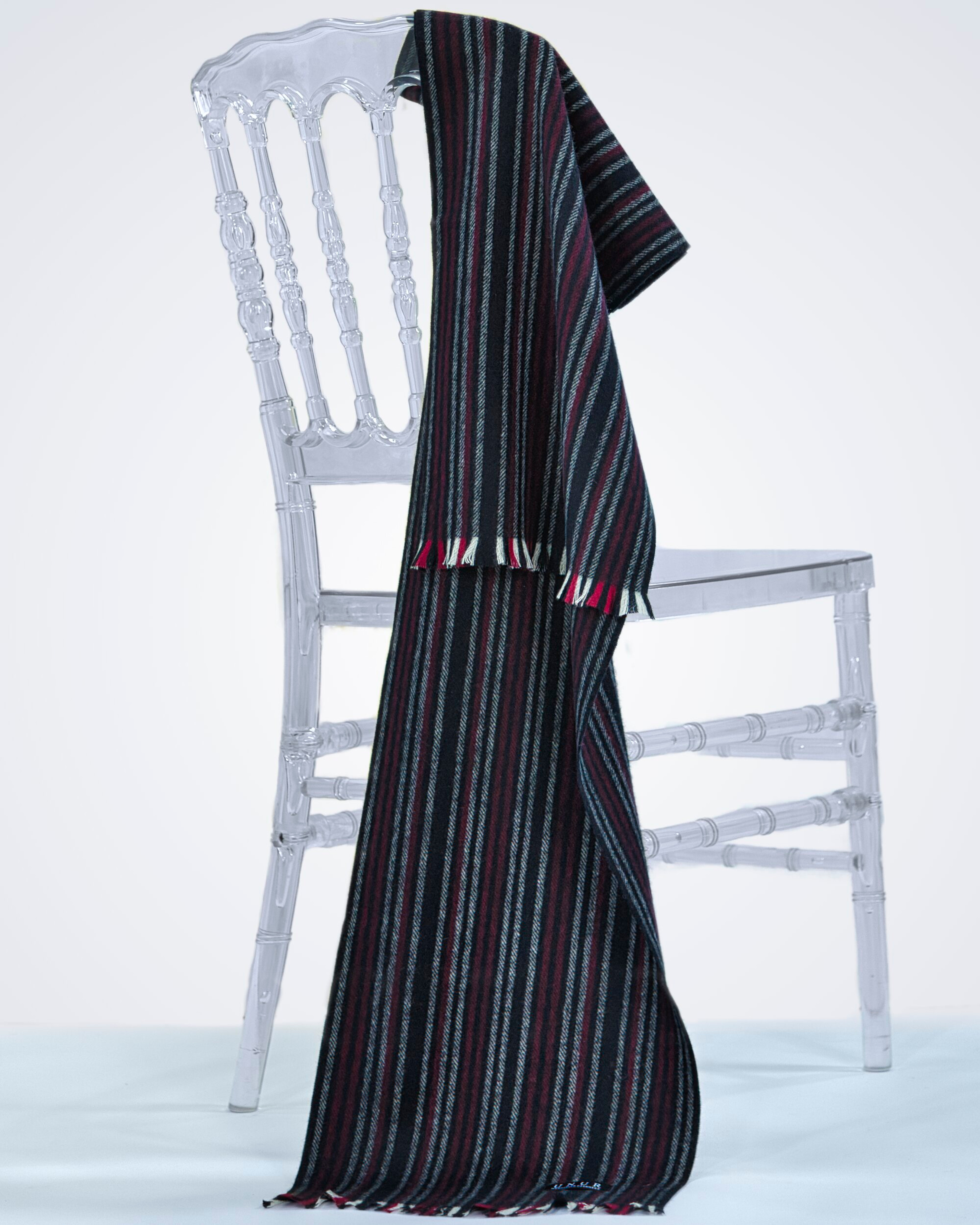 Unur model wearing a luxurious pinstripe cashmere scarf