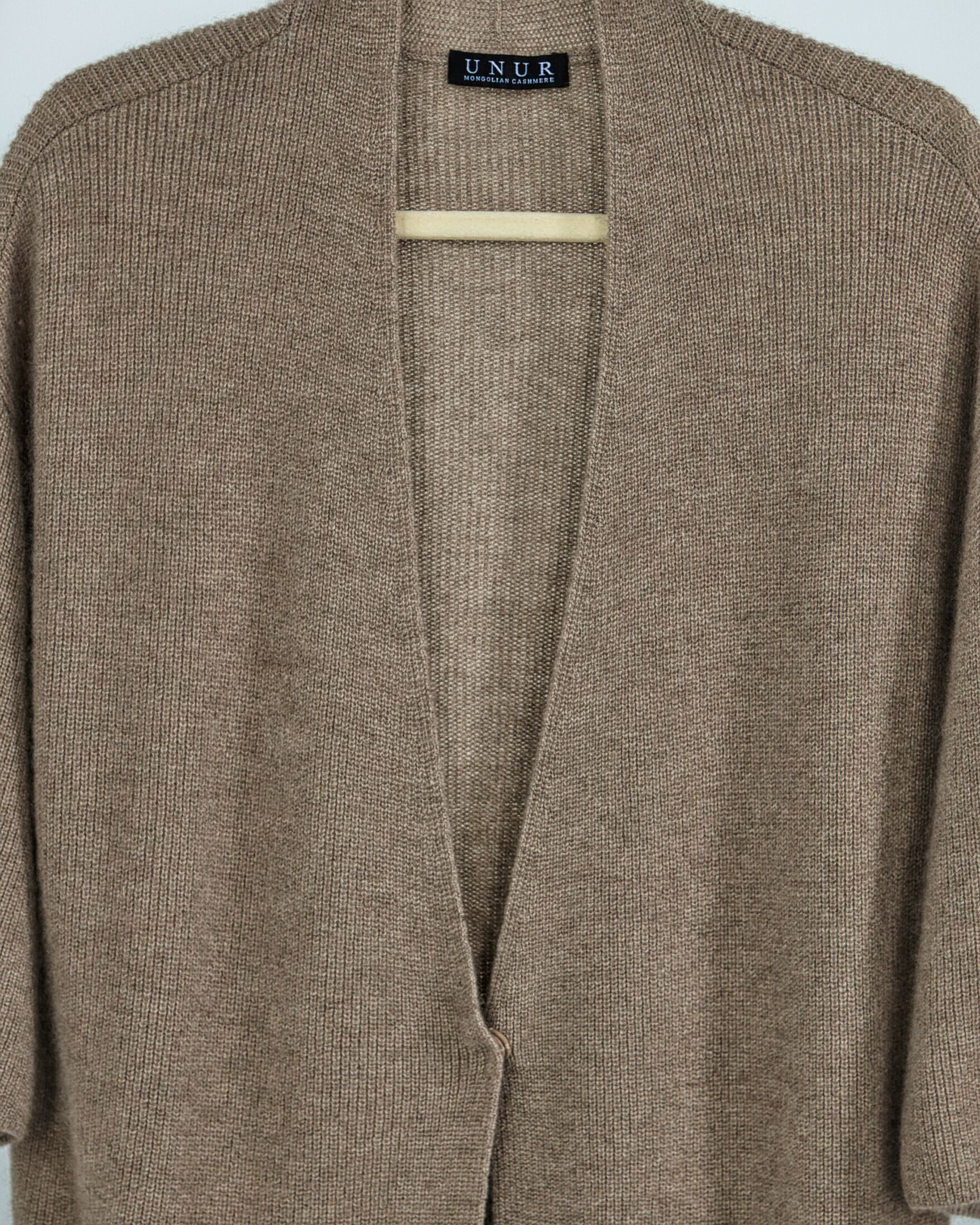 Close up of natural brown ribbed cashmere long cardigan coat