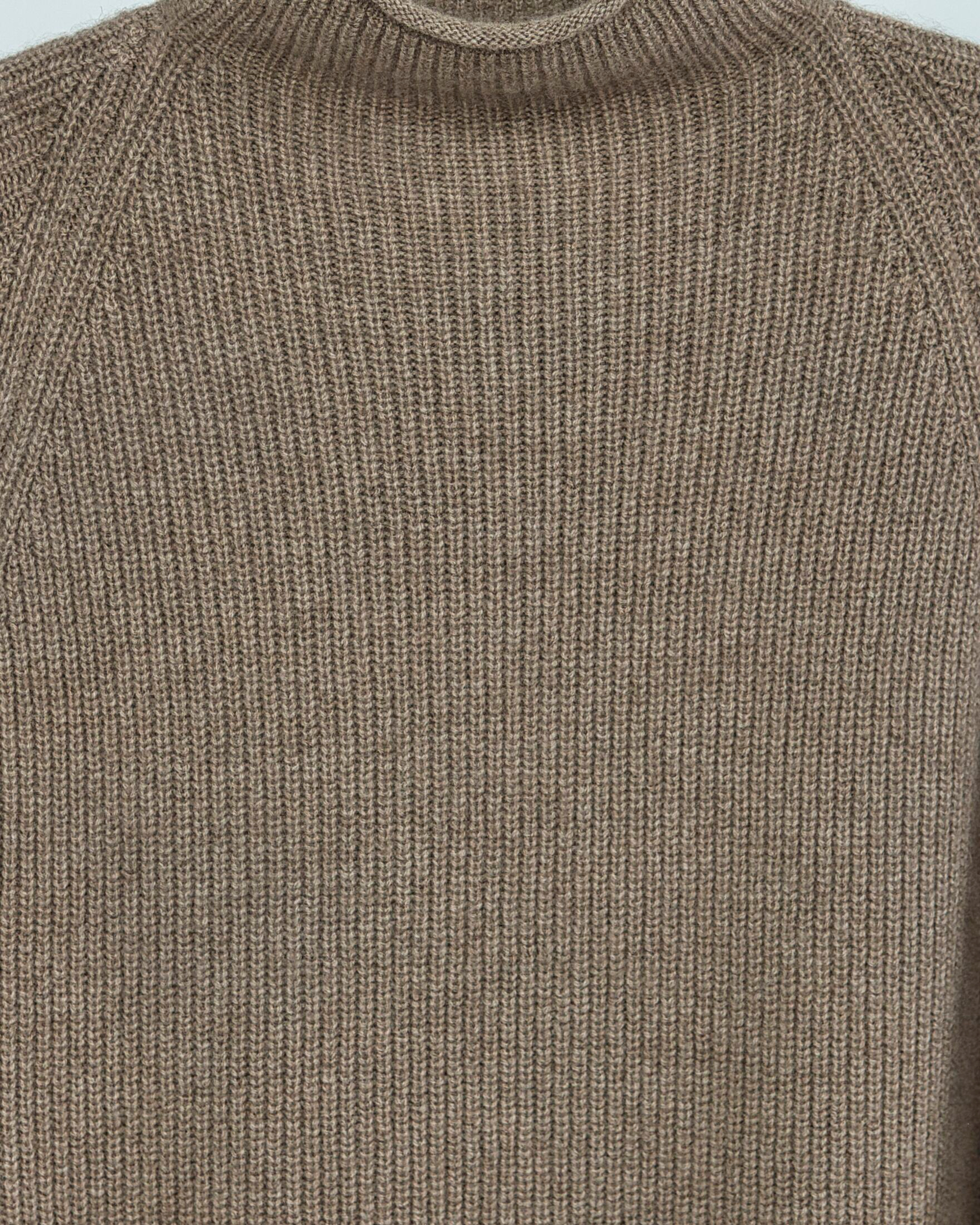 Close up of the ribbed texture of a natural brown cashmere jumper