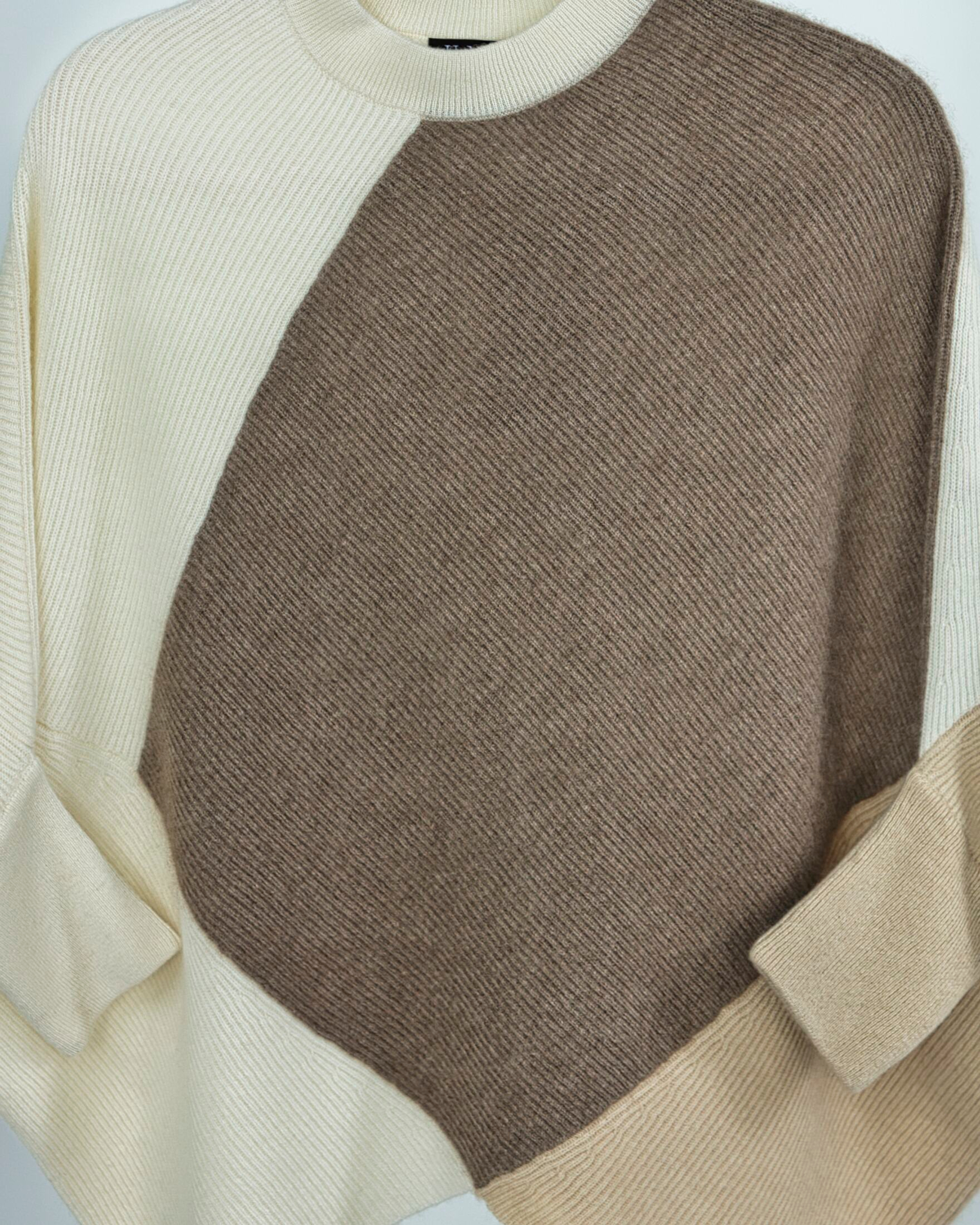 Close up of ribbed knit cashmere jumper in two-tone natural brown