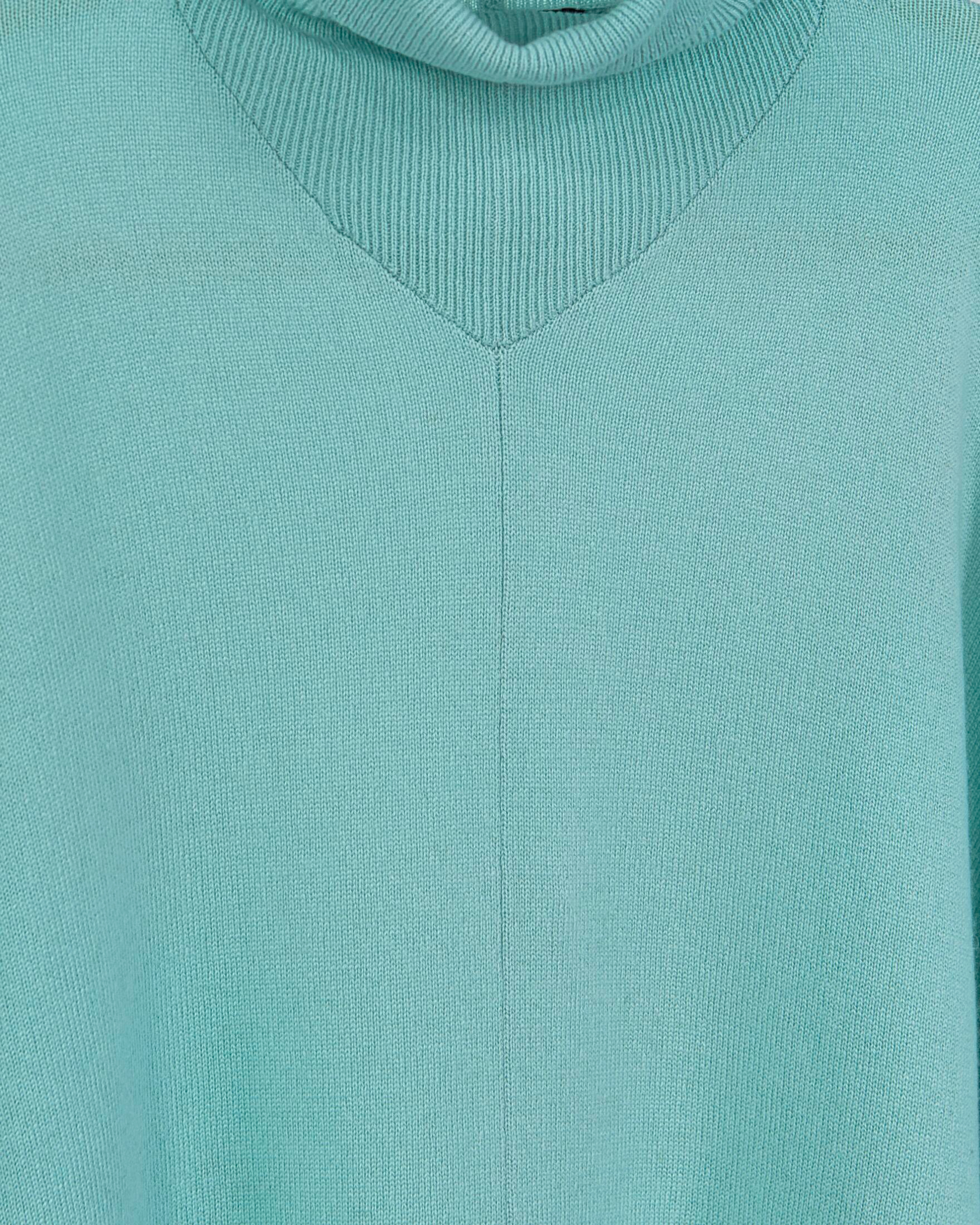 Close up of batwing turtleneck cashmere poncho with ribbing in mint green