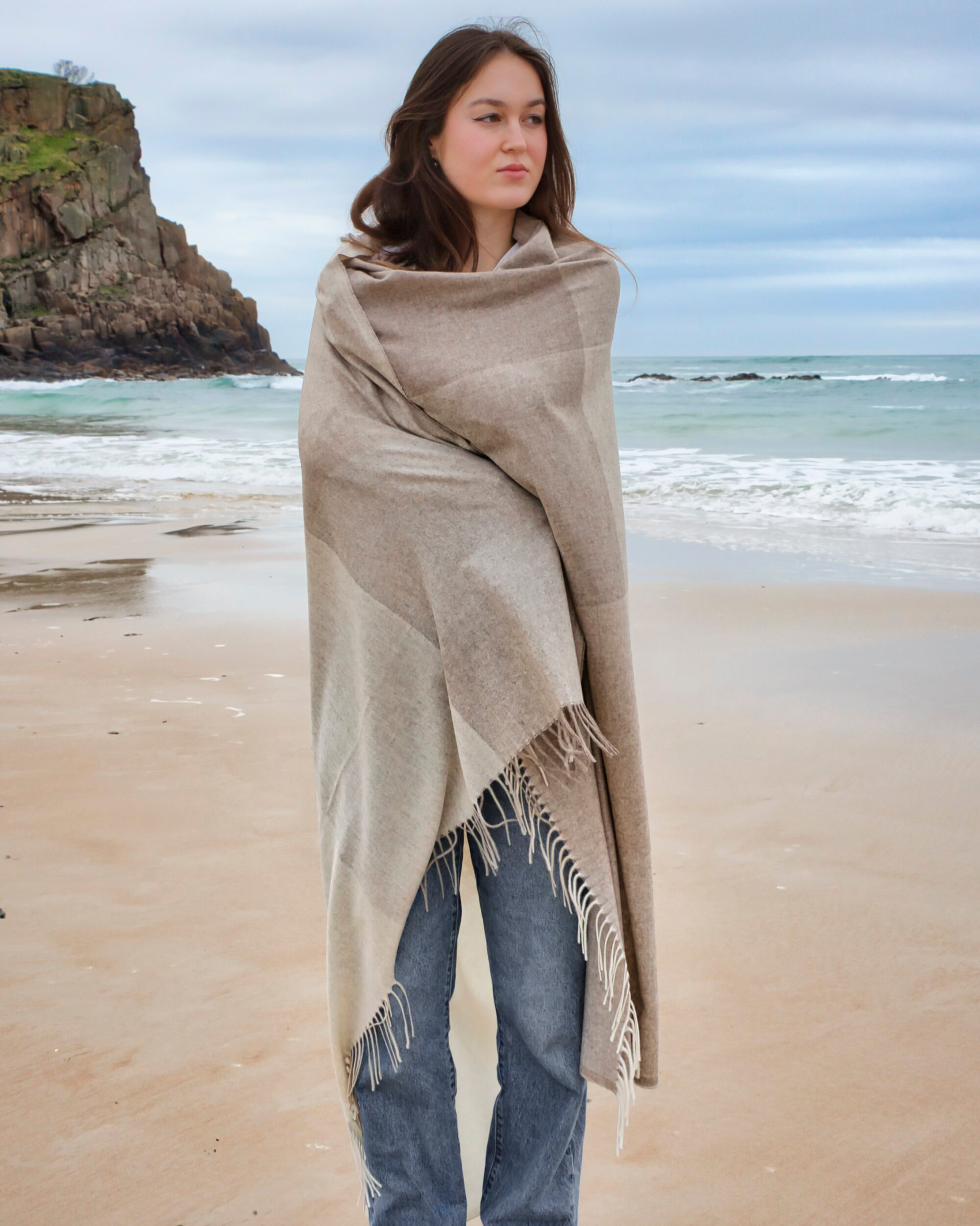 Unur model wearing a cashmere check pattern wrap shawl in natural brown tones