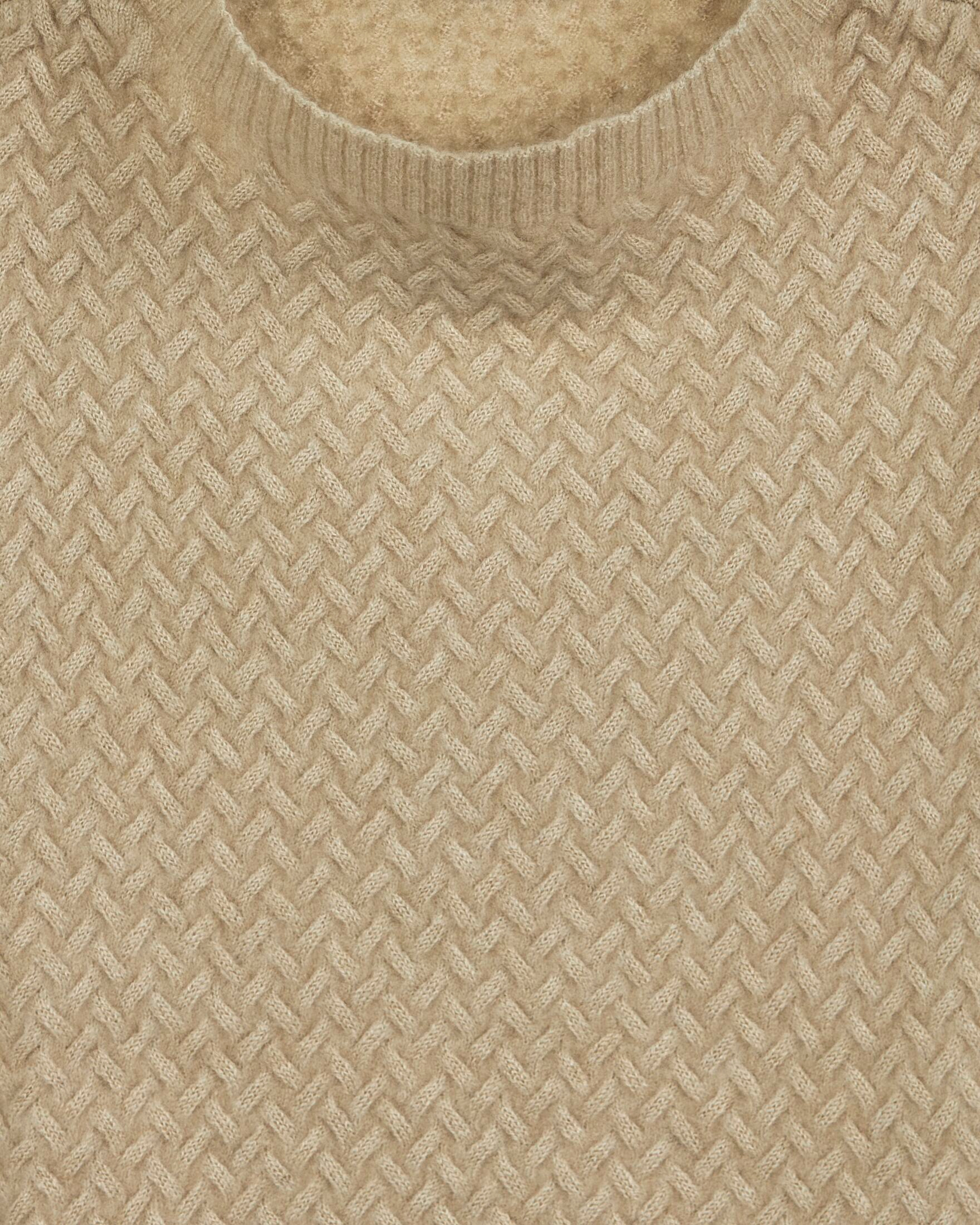 Close up of luxury cable knit cashmere vest in natural beige