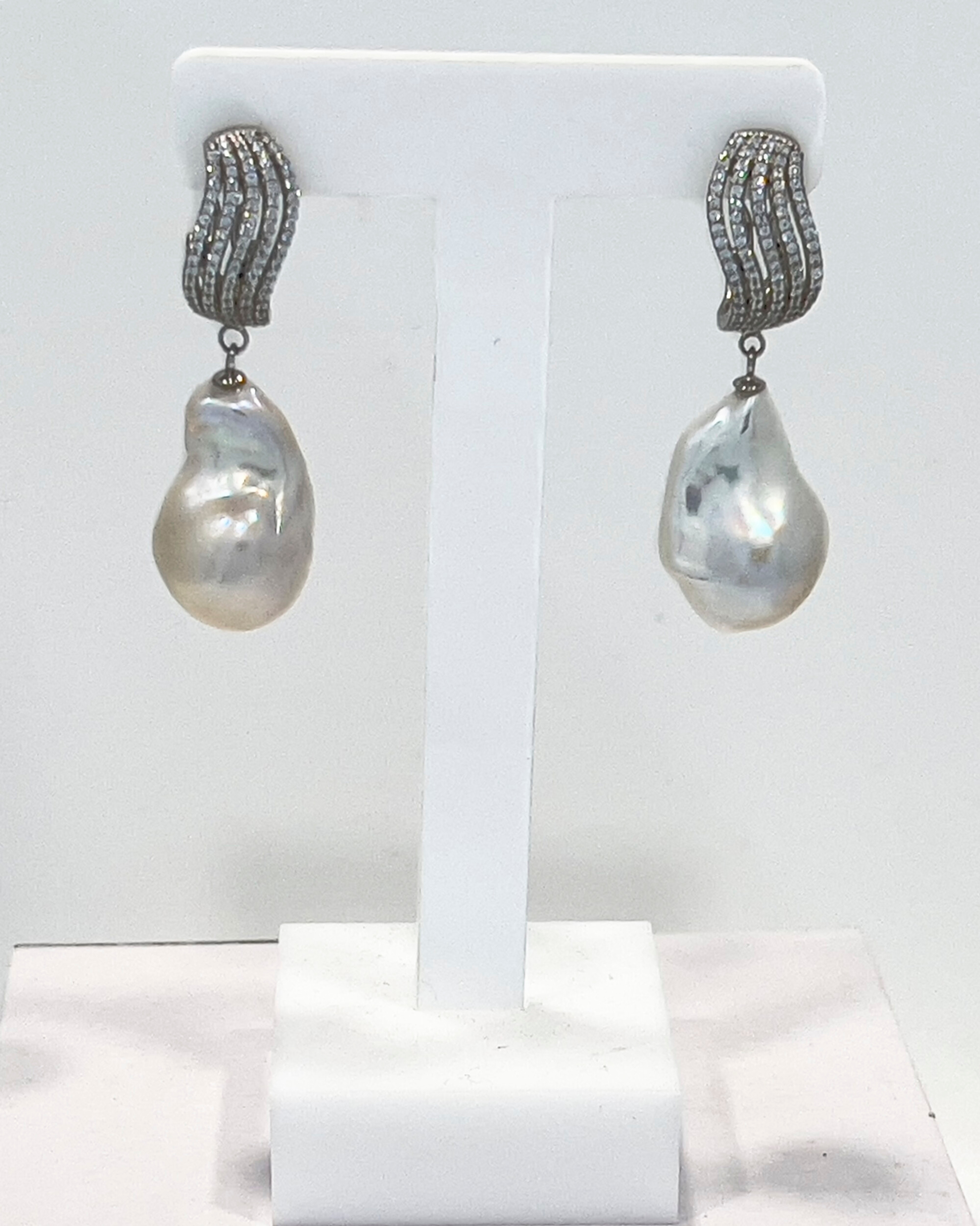 Signature baroque pearl drop earrings with a silver crystal wave