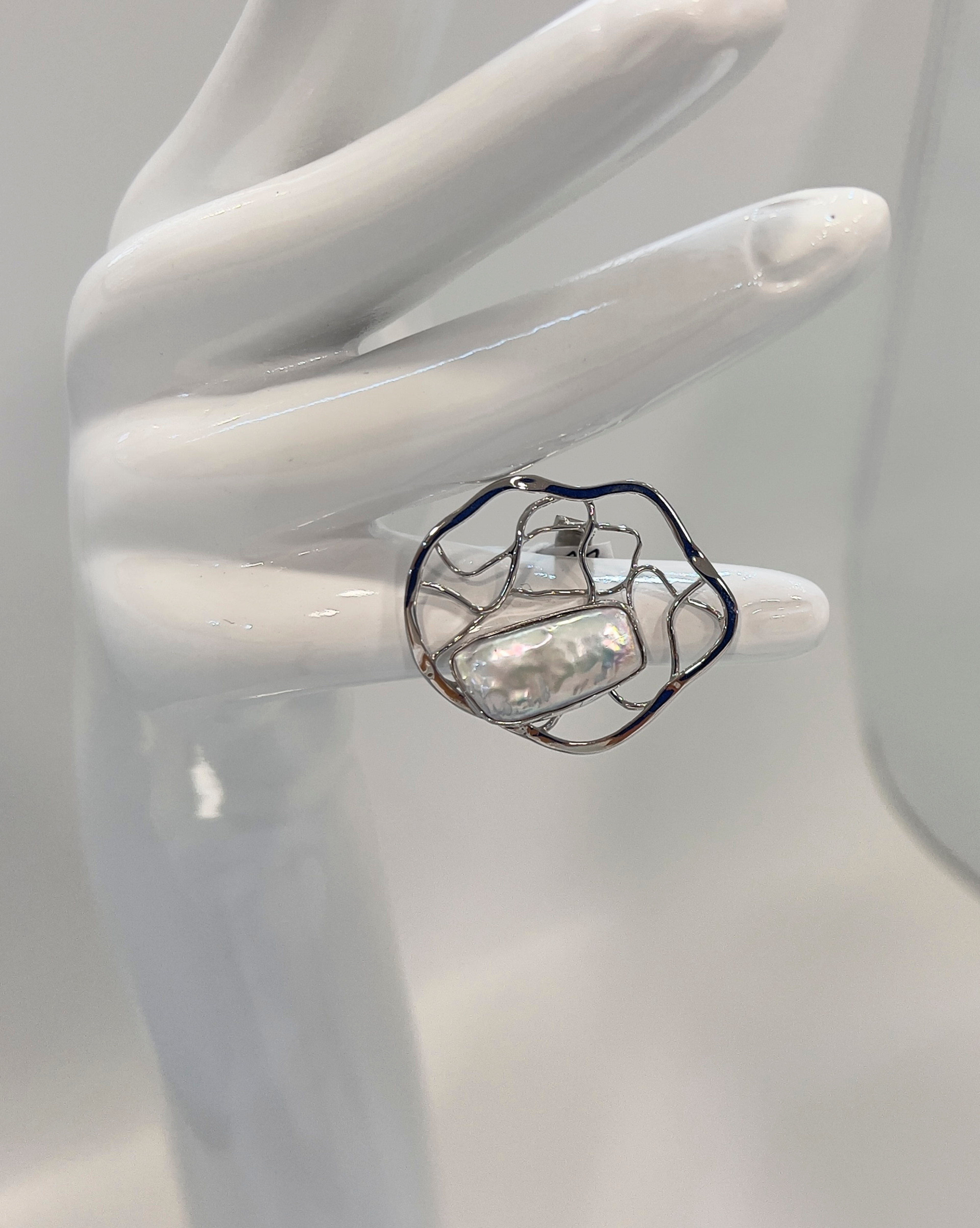 Signature statement ring with a large keshi pearl and a silver lattice band