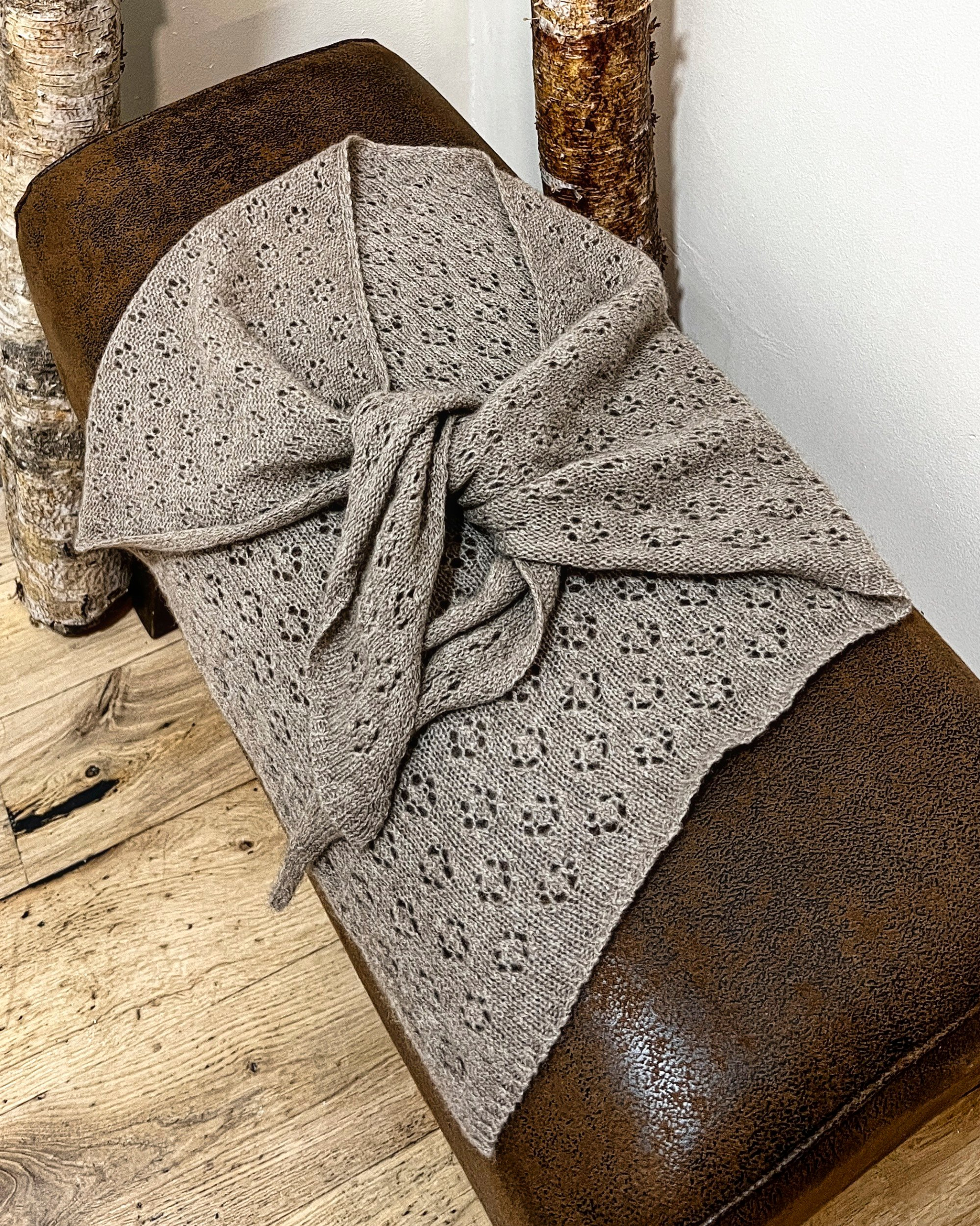 Natural brown cashmere neck-tie on neutral background, flat view