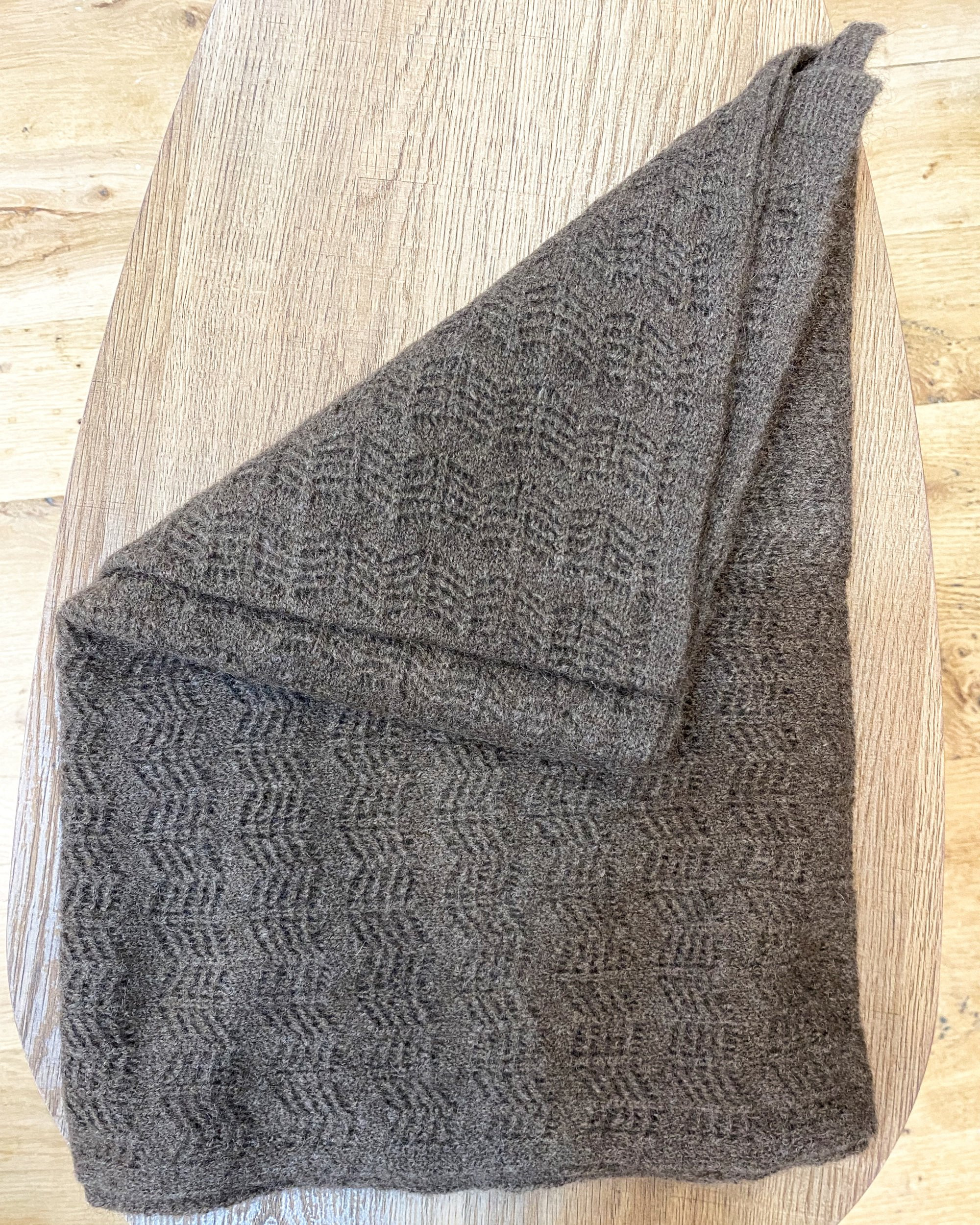 Close-up of soft yak wool chevron pattern shawl in brown