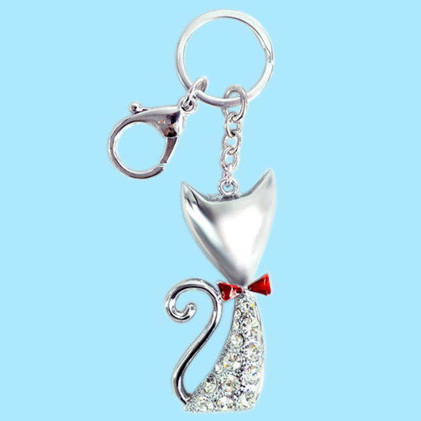 Silver cat shape keychain with red red bow and silver crystal design