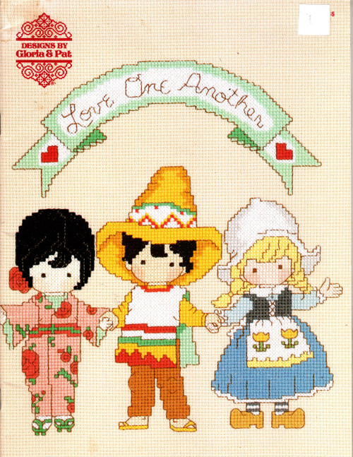 Designs by Gloria & Pat Love One Another counted Cross Stitch Pattern booklet. Joan Walsh Anglund. United States, France, Japan, Spain, Germany, Africa, Netherlands, India, Saudi Arabia, Hawaii, Eskimo, Mexico, Brazil, Sweden, China, Italy, Israel, Russia, Greece, Ireland, United Kingdom, Love Joins Us All, Love Begins With You, Love One Another.