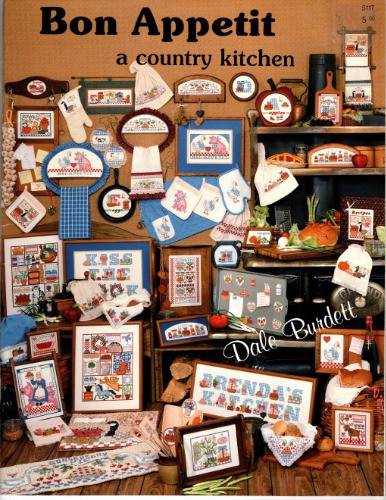 Dale Burdett Bon Appetit A Country Kitchen counted cross stitch booklet. Polly Carbonari. Bon Appetit, Susana's Kitchen, Watermelon, Gooseberry Pie, Preserve with Love, Antique Sampler, Country Sampler, Country Kitchen Sampler, Handmade is Heartfelt, Antiques, Welcome Cider, Bread Cover Border, Borders, Keys Memos Notes Recipes, Canadian Geese, Welcome Canadian Goose, Fresh Milk, Fresh Eggs, Fresh Spring Peas, Carousel Pig, Chocolate Moose, Spring, Summer, Fall, Winter, Kiss the Cook, Apples, Eggs, Alphabet