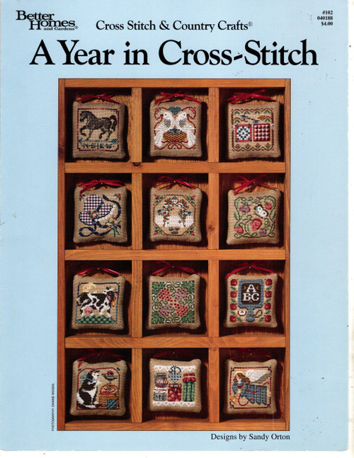 BH&G Cross Stitch & Country Crafts A Year in Cross Stitch counted Cross Stitch Pattern leaflet. Sandy Orton. January Horse, February Doves, March Quilts, April Sunbonnet, May Rose Arbor, June Butterfly and Sweet Peas, July Cow and Moon, August Grapes and Vines, September Apples and Slate, October Cat and Basket, November Canning Jars, December Country Angel