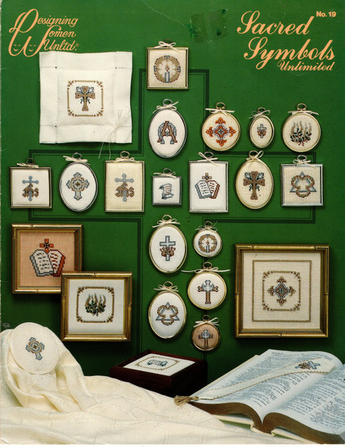 Designing Women Unltd Sacred Symbols Unlimited counted cross stitch leaflet. Cross and Crown, Holy spirit Cross, Sanish Cross, Scroll, Alpha and Omega, Lily Cross, Burning Bush, Candle, Tablets, Trinity, Cross Fleuree, IHS