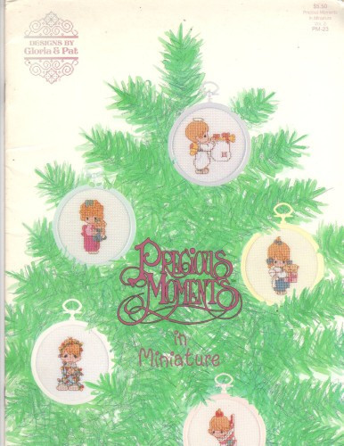 Designs by Gloria & Pat PRECIOUS MOMENTS IN MINIATURE PM-23 Cross Stitch Pattern booklet. A Perfect Holiday Season, Let the Heavens Rejoice, To Thee With Love, The Purr-fect Grandma, O come All Ye Faithful, To a Special Dad, Love is Patient, Jesus is the Light that Shines, Serve with a Smile, I'll Play My Drum for Him, The Perfect Grandpa, Mother Sew Dear, Baby's First Christmas, Rejoice O Earth, My Love Will Never Let You Go, Smile Along the Way, Tell Me the Story of Jesus, May Your Christmas Be Delightful, Love is the Best Gift, Rejoice O Earth, Merry Christmas, Waddle I Do Without You, Cheers to the Leader, Our First Christmas Together, Stocking alphabet. Instructions for ornaments and afghan