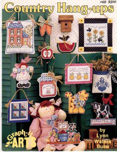 Graph It Arts Country Hang Ups Cross Stitch Pattern booklet. Lynn Waters Busa. No Crows Allowed, Pineapple Welcome, Watermelon, Home Sweet Home, Preserved with Love, Country Doll, Pretty Kitty, Folk Art, Apple, Log Cabin Quilt, Fresh Milk, Country Shelf.