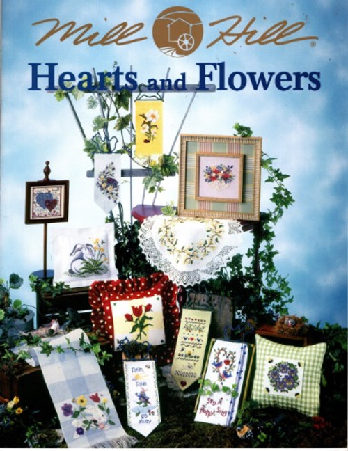 Mill Hill Hearts and Flowers counted cross stitch booklet. April Showers Banner, Narcissus Banner, Birdhouse Banner, Grape Vine Table Runner, Framed Floral Bouquet, Mini Heart Banner, Bunny Pillow, Pansy Wreath Pillow, Daisy Banner, Spring Floral Wreath, Forsythia Wreath, Time Began in a Garden, Garden Sampler, Heart Candlescreen Frame, Bunny Table Runner, Sing a Happy Song Banner, Rain Rain Go Away, Trio Heart Pillow, Tulip Pillow