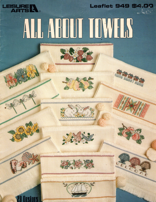 Leisure Arts All About Towels Cross Stitch Pattern booklet. Kooler Design Studio. Shell Welcome, Butterflies, Dragonflies, Penguins, Dolls, Roses, Cacti, Southwest Design, Coyotes, Cats, Southwest Design, Irises, Sailboats, Southwest Welcome, Pears, Strawberries, Bunnies, Sunflowers, Bunnies on Checkerboard, Be My Guest, Tulips, Ship, Home Sweet Home, Three Shells, Doves, Birds, Peaches, Four Shells, Basket of Flowers