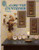 Designs by Gloria & Pat Along the Countryside Counted Cross Stitch Pattern booklet. Dried Flower Arrangements, Windmill and Watertower, Water Wheel, Grain Bins, Tobacco Barns 1 and 2, Bearded Wheat and Lotus Pods, Eucalyptus, Teasel with Dock, Money Plant with dock, Yarrow, Okra, Cattails with Yarrow, Cotton