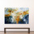 Large abstract painting dominated by luminous, looping gestures in creamy white, warm ochre, golden yellow and burnt orange. 