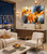 Autumn on Fire 48x40 original abstract painting styled in modern living room above light oak console with fall landscape outside window. Burnt orange and navy blue abstract brings warmth to neutral linen curtains and natural light - statement art for living room