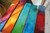 Close-up heavy textured detail of Blocks of Colors - hand-sculpted rainbow texture turquoise yellow orange mixed media
