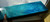 Close-up heavy textured detail of Blocks of Colors - hand-sculpted rainbow texture turquoise yellow orange mixed media