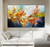 Fury and Bloom original abstract art - explosion of golden yellow, coral pink, tangerine orange and deep navy blue - textured large-scale joyful painting full of movement and light - abstract floral storm - Montreal artist Andrada Anghel - andradafineart.com