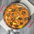 Winco CSPP-14 14 1/8" Polished Carbon Steel Paella Pan