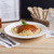  CAC REC-115 American White (Ivory / Eggshell) Wide Rim 24 oz. Rolled Edge China Pasta Bowl - WREPB