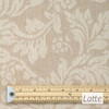 Catalonia Damask Acrylic Coated Fabric. Colour: Latte - pictured with a wooden rule.