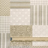 Wipe Clean Fabric - Mirha Patchwork. Pictured with a wooden ruler