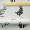 Wipe Clean Tablecloth - Acrylic Coated-  Loneta: Two Tone Chickens. Pictured with a wooden ruler