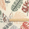 Wipe Clean Fabric - Navarra: Monstera.  Pictured with a wooden metre rule to show scale.