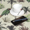 Digital Palm: Wipe Clean Tablecloth - pictured with a cup and saucer, 'phone and pen