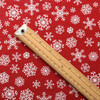 Symphony: Snowflake Acrylic Coated Fabric - pictured with a wooden metre rule to show scale.