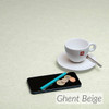 Loneta Dali Extra Wide Wipe Clean Tablecloth: Ghent Beige - pictured with a cup and saucer, 'phone, pen and coins.