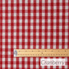 Wipe Clean Fabric- Mirha Yarn Dyed: Gingham Check - Cranberry. Pictured with a wooden ruler to show scale