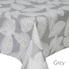Wipe clean tablecloth. Living Feathers - Grey. Pictured on a table.