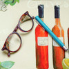Wipe Clean Tablecloth - Digital Napoli. Pictured on a table with a pair of glasses and a pen