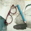 Wipe Clean Tablecloth - Digital Zen Garden. Pictured with a pair of glasses and a pen.