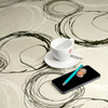 Wipe Clean, Acrylic Coated Tablecloth - Loneta: Turner. Pictured with cup and and saucer, 'phone, and pen.