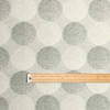 Living Circles Grey:  Wipe Clean Fabric. Pictured with a wooden metre rule to show scale.