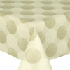 Living Circles Beige: Acrylic Coated Tablecloth. Shown on a table.