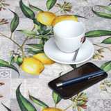 Digital : Limonero.  Wipe Clean Tablecloth pictured with a cup, saucer and phone